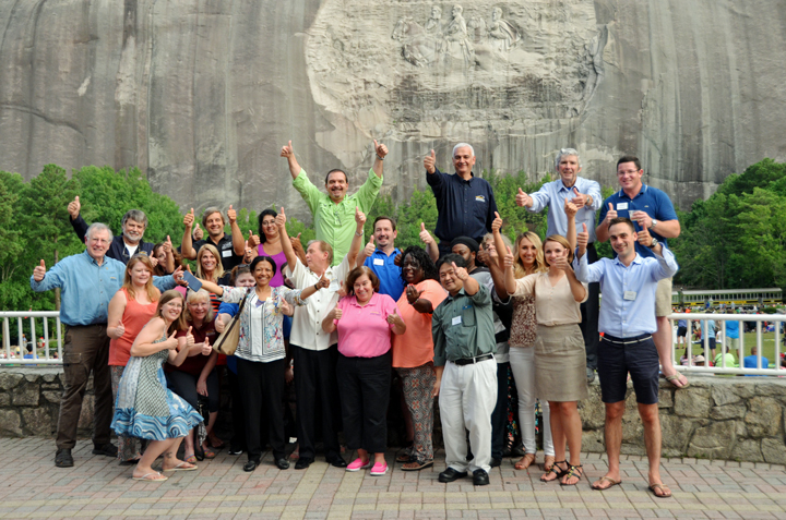 Street Smart Reunion attendees giving a thumbs up together outdoors